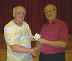 John receives winner's cheque from Herefordshire President Nigel Beveridge