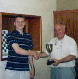 Steve Mellor (left) receives the trophy from Jim Keene